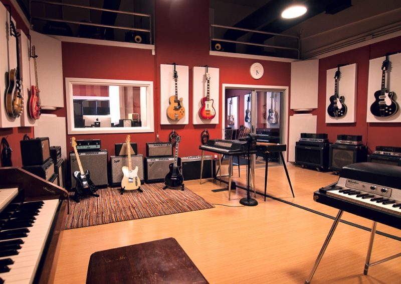 Lost Ark Studio Acoustics using GIK Acoustics acoustic panels and bass traps in corners and ingenious recording studio design ideas of hanging guitars in front of panels