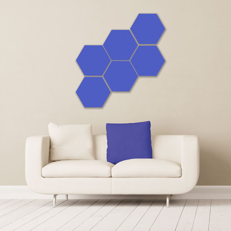 Gik acoustics hexagon acoustic panels small blue above couch