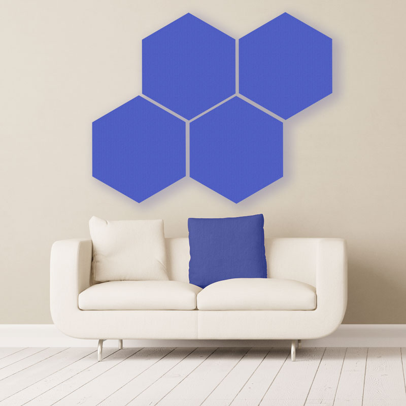 Gik acoustics hexagon acoustic panels large blue above couch