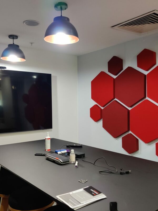 office acoustics using decorative hexagon acoustic panels in a conference room